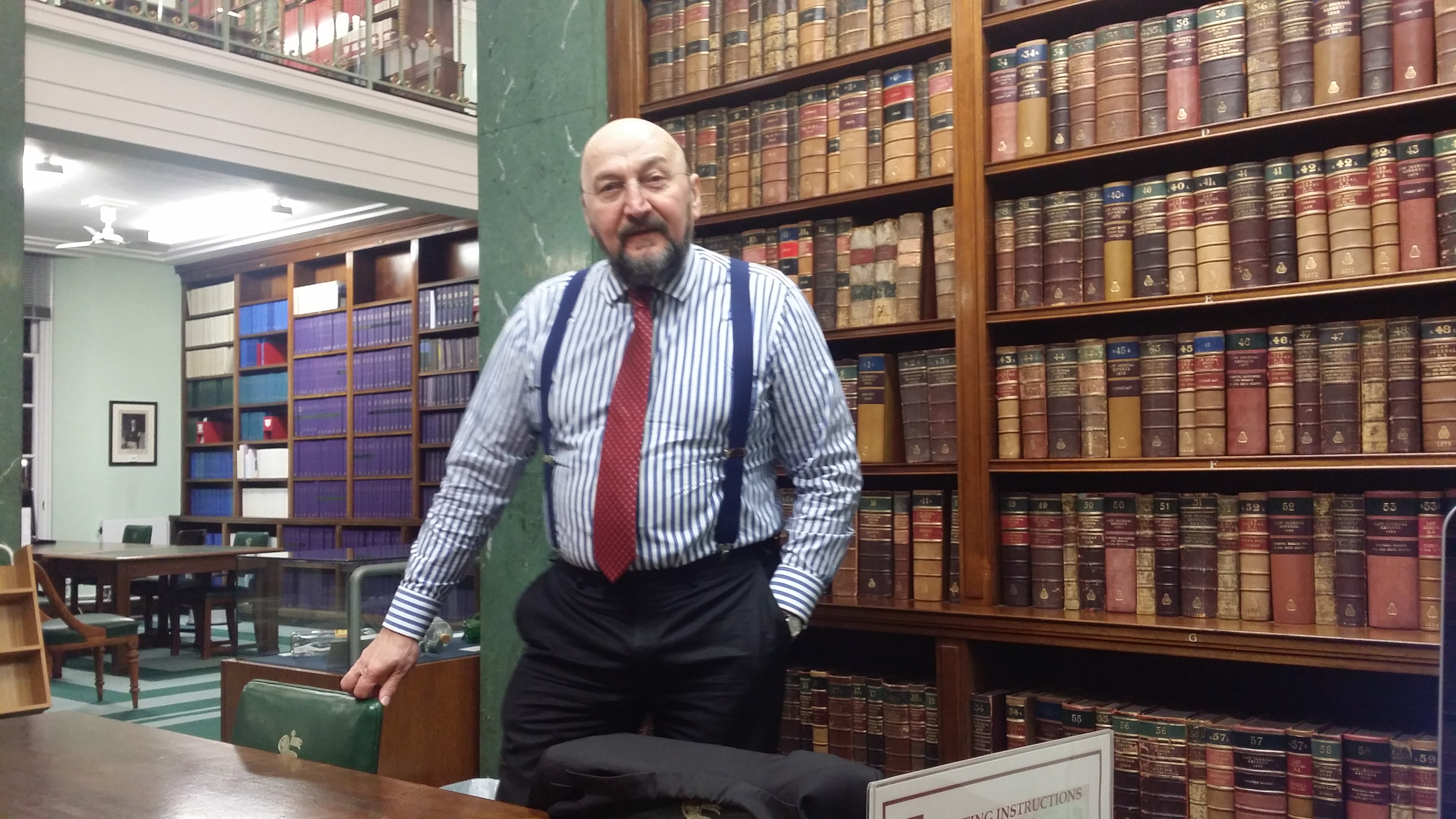 Prof. Andre S. Pazik in the law library — 20 years working with medical negligence and personal injury firms